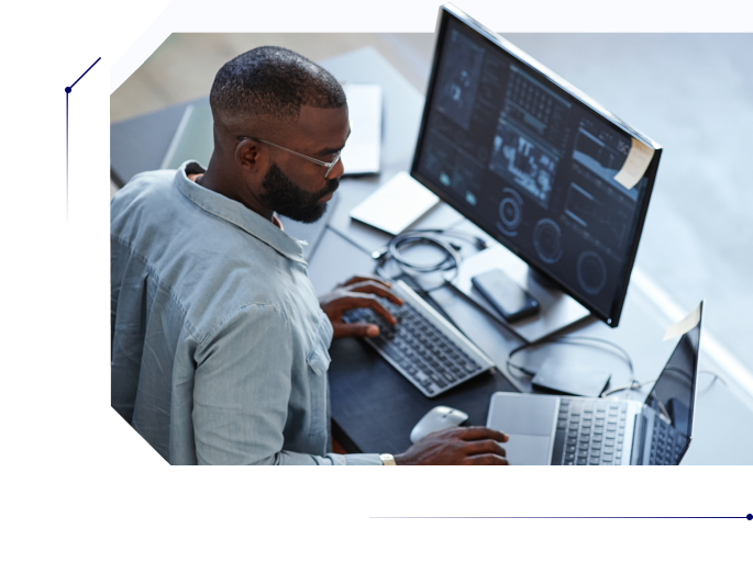 Bearded man using his computer at work