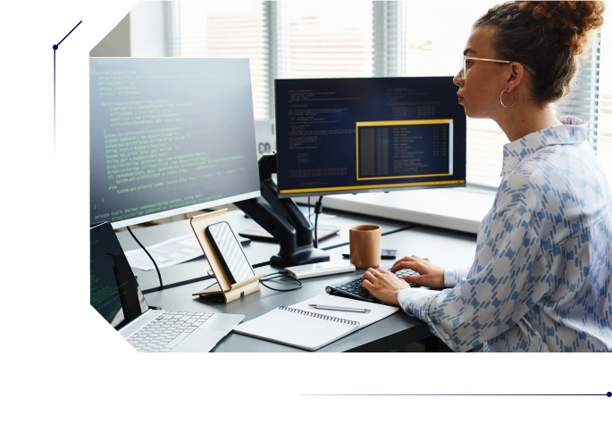 Woman in her 20s writing code in her computer