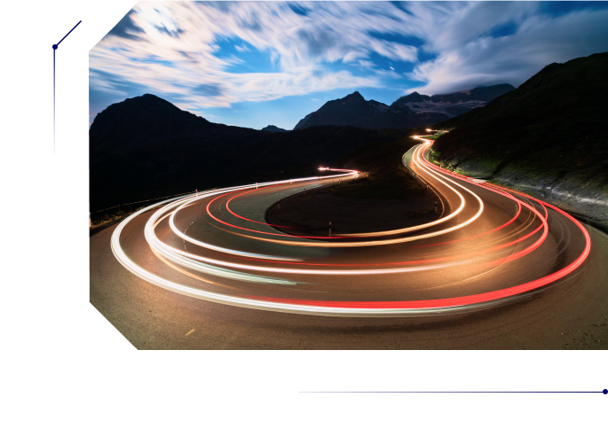 A light trail made by a fast vehicle in a curved road