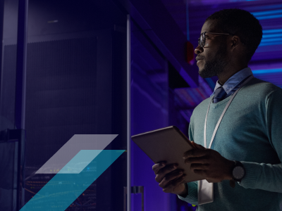 Man standing in data center hallway
