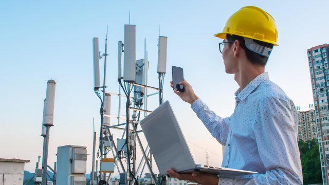 Worker testing signal strength