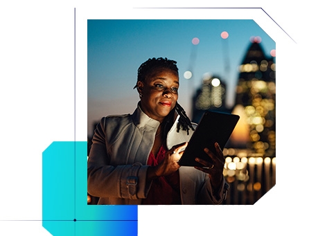 A woman using a tablet with a cityscape in the background