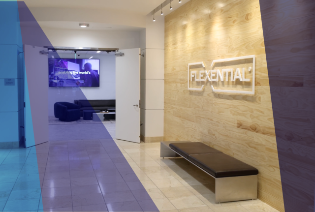 Modern office lobby with wood panel wall displaying Flexential logo, bench seating, open doorway to lounge area, and blue graphic overlay.