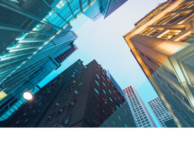 Upward view of modern city skyscrapers framed against the sky, with blue and gold geometric overlays highlighting urban infrastructure